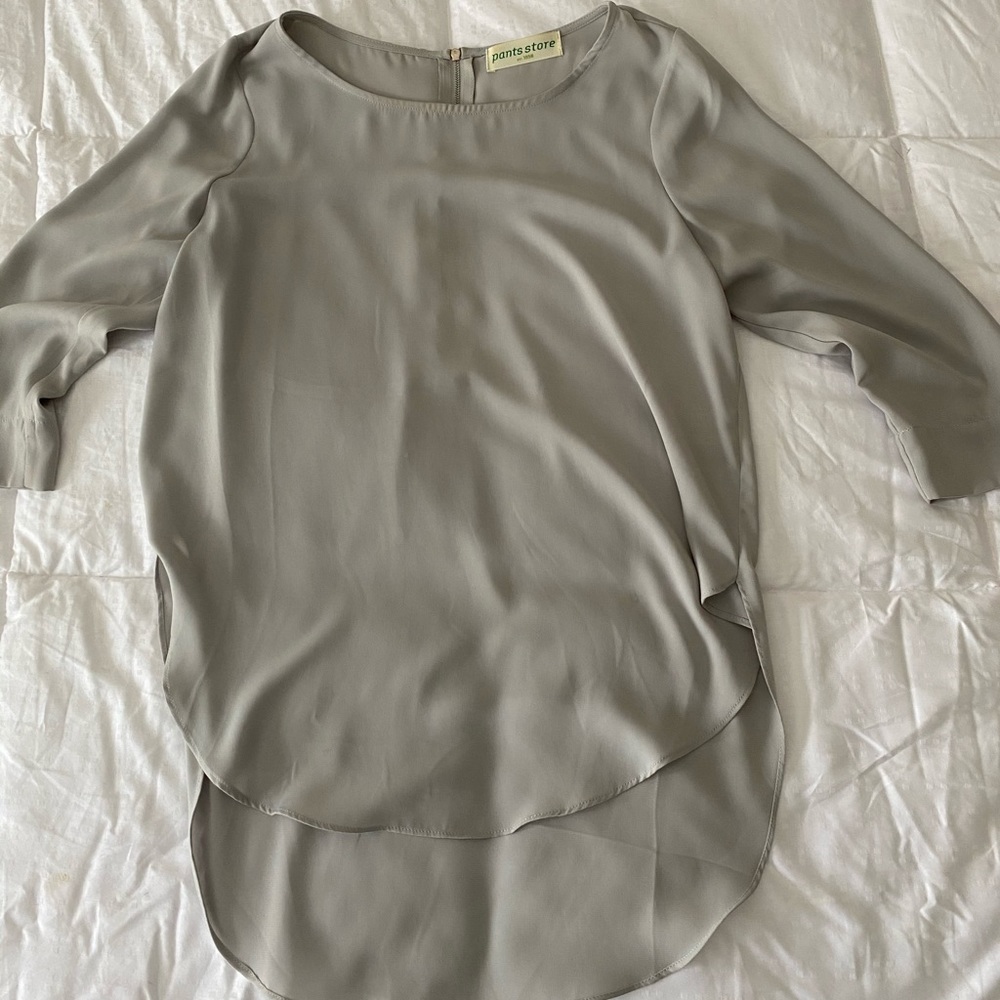 pants store light grey shirt